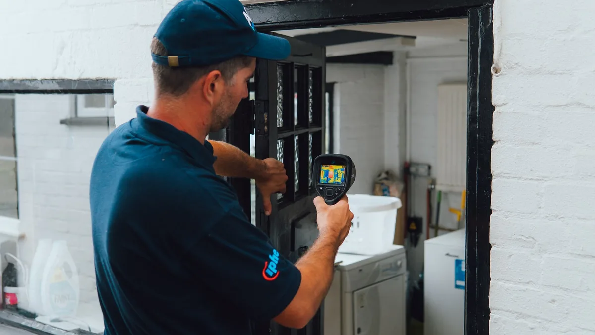 ADI engineer using a thermal camera to check a building surface